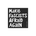 Make Fascists Afraid Again Sticker & Magnet on a black panel with bold white text, set against a blurred park background. Fea