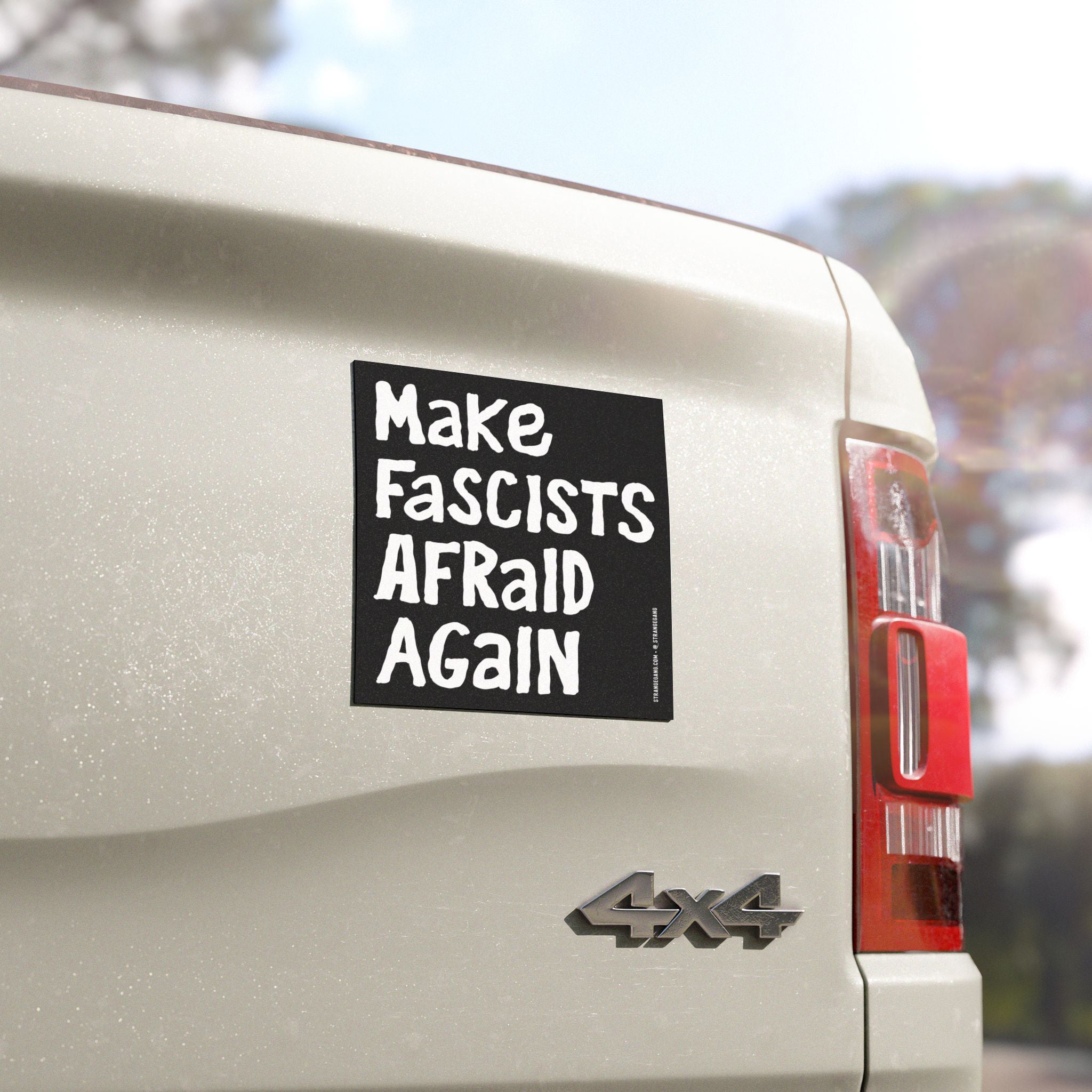 Make Fascists Afraid Again Sticker & Magnet on a 4×4 pickup tailgate, featuring bold, white lettering on black, advocating against fascism with weatherproof design for cars, laptops, or signs.