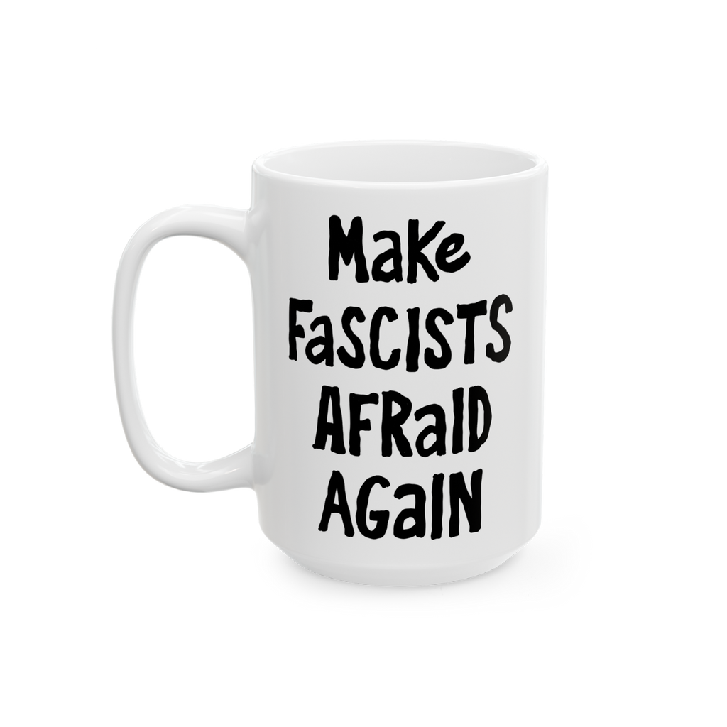 White ceramic mug with black, hand-drawn lettering: “Make Fascists Afraid Again”. Bold message supports resistance, ideal