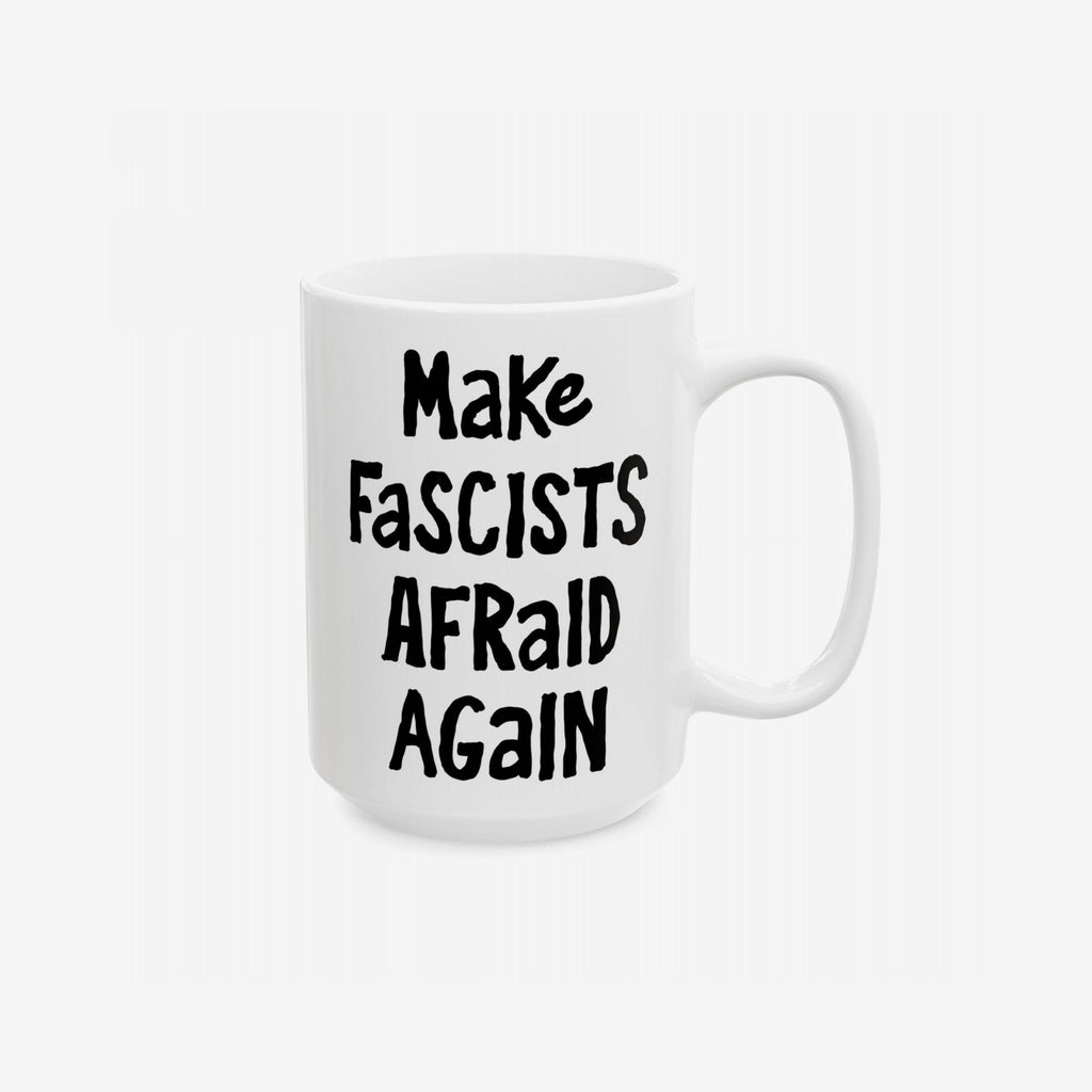 White ceramic mug with Make Fascists Afraid Again in bold black lettering. Designed to challenge authoritarian views, it supports equality and resistance. Available in 11 oz. and 15 oz. sizes. Lead and BPA-free.