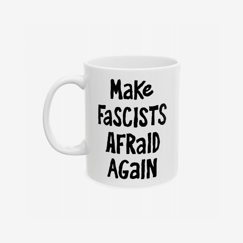 White ceramic mug with the slogan Make Fascists Afraid Again in bold black lettering. Features a standard C-handle, shiny finish, printed on both sides, and available in two sizes.