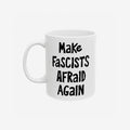 White ceramic mug with the slogan Make Fascists Afraid Again in bold black lettering. Features a standard C-handle, shiny finish, printed on both sides, and available in two sizes.