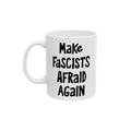 White ceramic mug with the slogan Make Fascists Afraid Again in bold black lettering. Features a standard C-handle, shiny finish, printed on both sides, and available in two sizes.