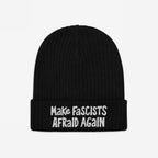 Black rib-knit beanie with Make Fascists Afraid Again in white embroidery, offering a bold, rebellious statement. Ideal for activists, features hand-drawn style for everyday resistance. Supports ACLU.