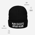 Black, cuffed, double-layered knit beanie with “Make Fascists Afraid Again” embroidered in white on the front. Made from recycled polyester, featuring narrow rib knit construction and a statement against fascism.