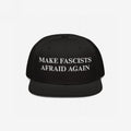 Black flat-brim cap featuring the bold slogan “MAKE FASCISTS AFRAID AGAIN” in white embroidery. The Make Fascists Afraid Again Classic Hat embodies a fearless anti-fascist statement, ideal for progressive activism.