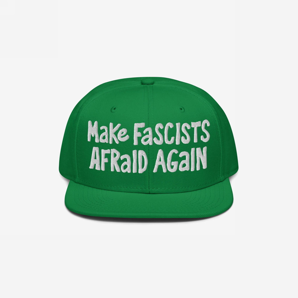 Green, flat-brimmed Make Fascists Afraid Again hat with white, hand-drawn embroidery, symbolizing resistance and activism. Perfect for those standing against fascism and supporting equality.