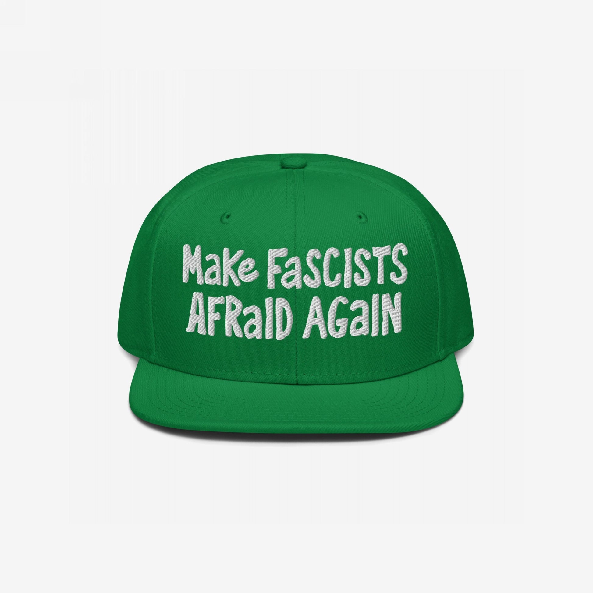 Green snap-back cap with bold white text reading Make Fascists Afraid Again, reflecting unapologetic resistance. Perfect for activism or everyday wear, supporting Amnesty International.