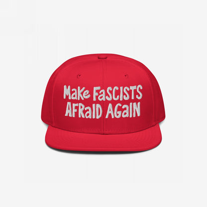 Red snapback cap with bold, white embroidered text: Make FASCISTS AFRAID AGAIN. A statement piece for unapologetic resistance, embodying defiance and activism.