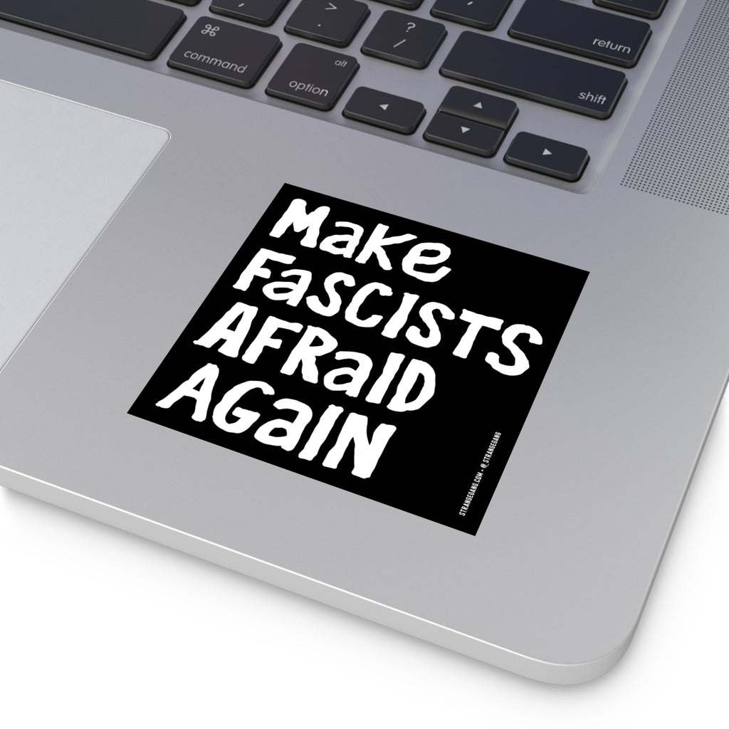 A silver laptop displays the Make Fascists Afraid Again sticker, featuring bold, hand-drawn lettering, symbolizing defiance against authoritarianism. Ideal for laptops, bumpers, or protest signs.