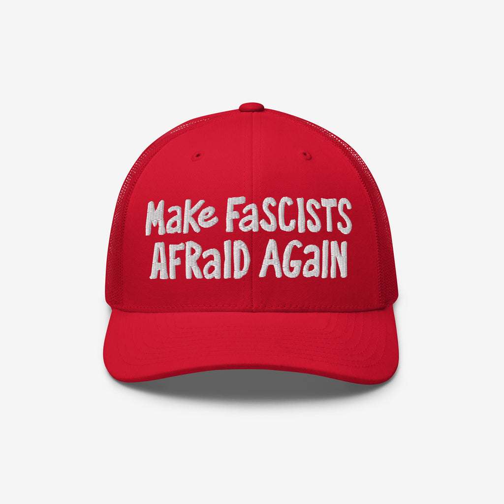 Make Fascists Afraid Again Hat features white embroidered text on a bright red trucker-style cap, emphasizing bold resistance with a curved bill and mesh back.