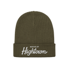Olive-green ribbed knit beanie featuring Mayor of Hightown embroidered in white on the cuff, embodying a playful, rebellious 