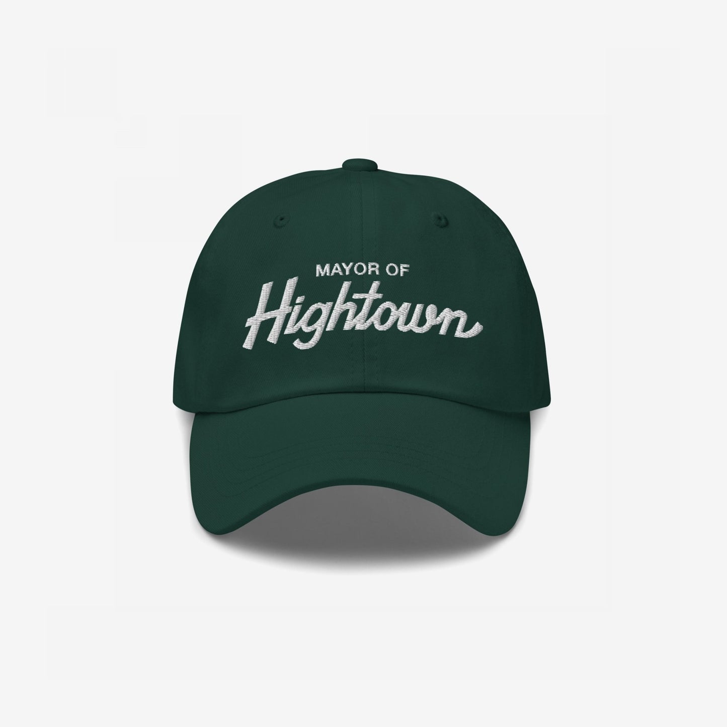 Dark-green Mayor Of Hightown Hat with white embroidered text, embodying a playful, rebellious spirit for cannabis enthusiasts and festival-goers, capturing the essence of elevated humor and carefree energy.