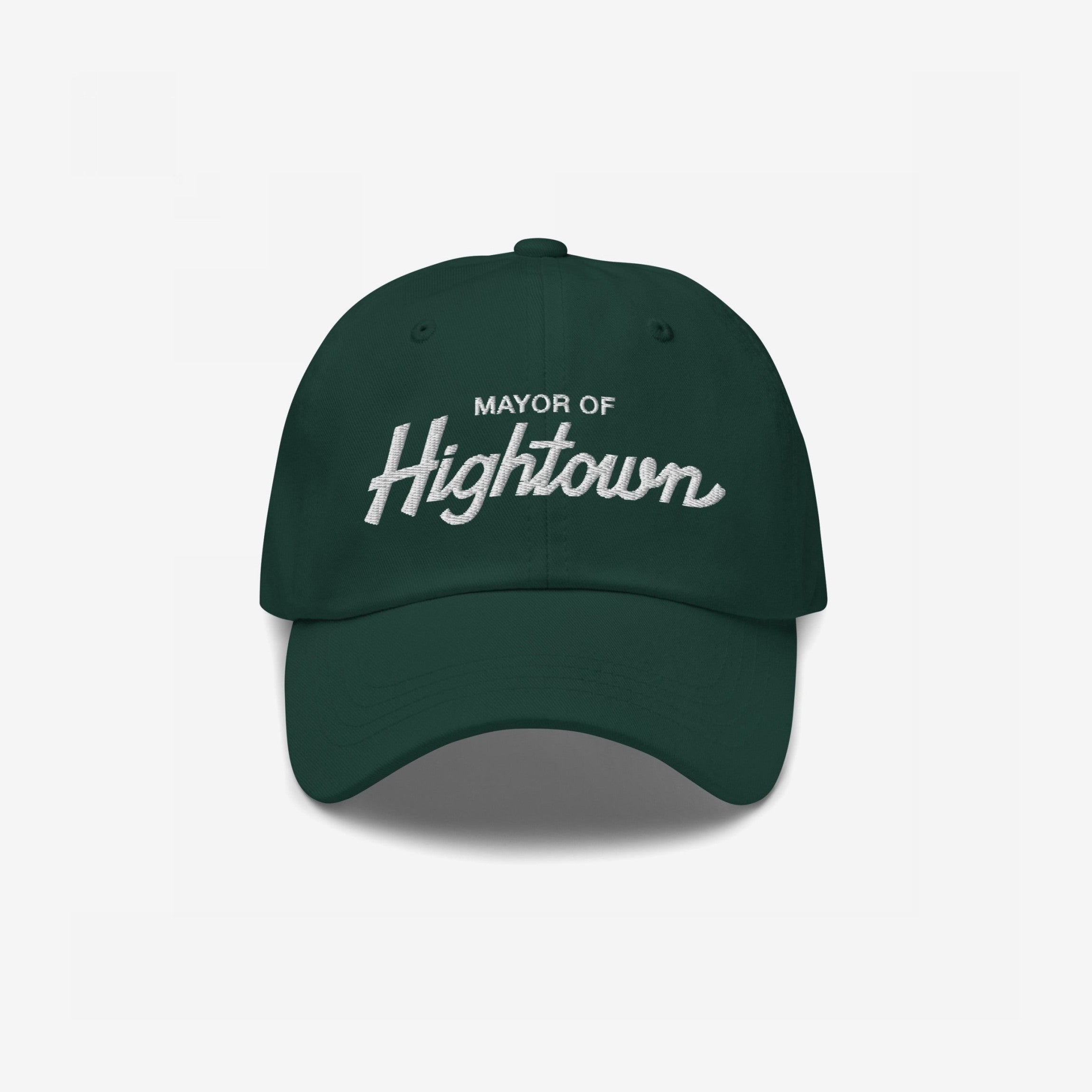 Dark-green Mayor Of Hightown Hat with white embroidered text, embodying a playful, rebellious spirit for cannabis enthusiasts and festival-goers, capturing the essence of elevated humor and carefree energy.