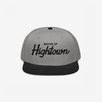 Two-tone flat-bill snapback cap with Mayor of Hightown embroidered on the front, embodying a playful and rebellious spirit ideal for cannabis enthusiasts and lovers of elevated humor.