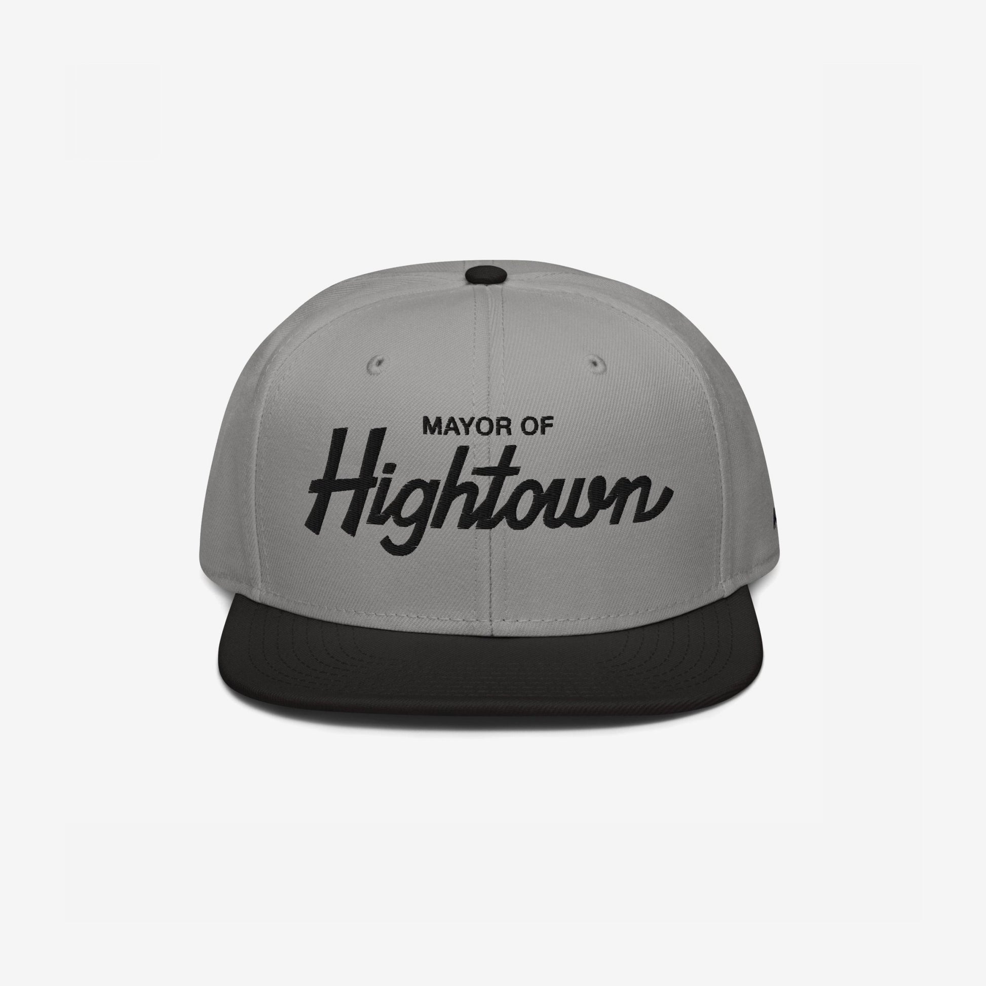 Two-tone flat-bill snapback cap with Mayor of Hightown embroidered on the front, embodying a playful and rebellious spirit ideal for cannabis enthusiasts and lovers of elevated humor.