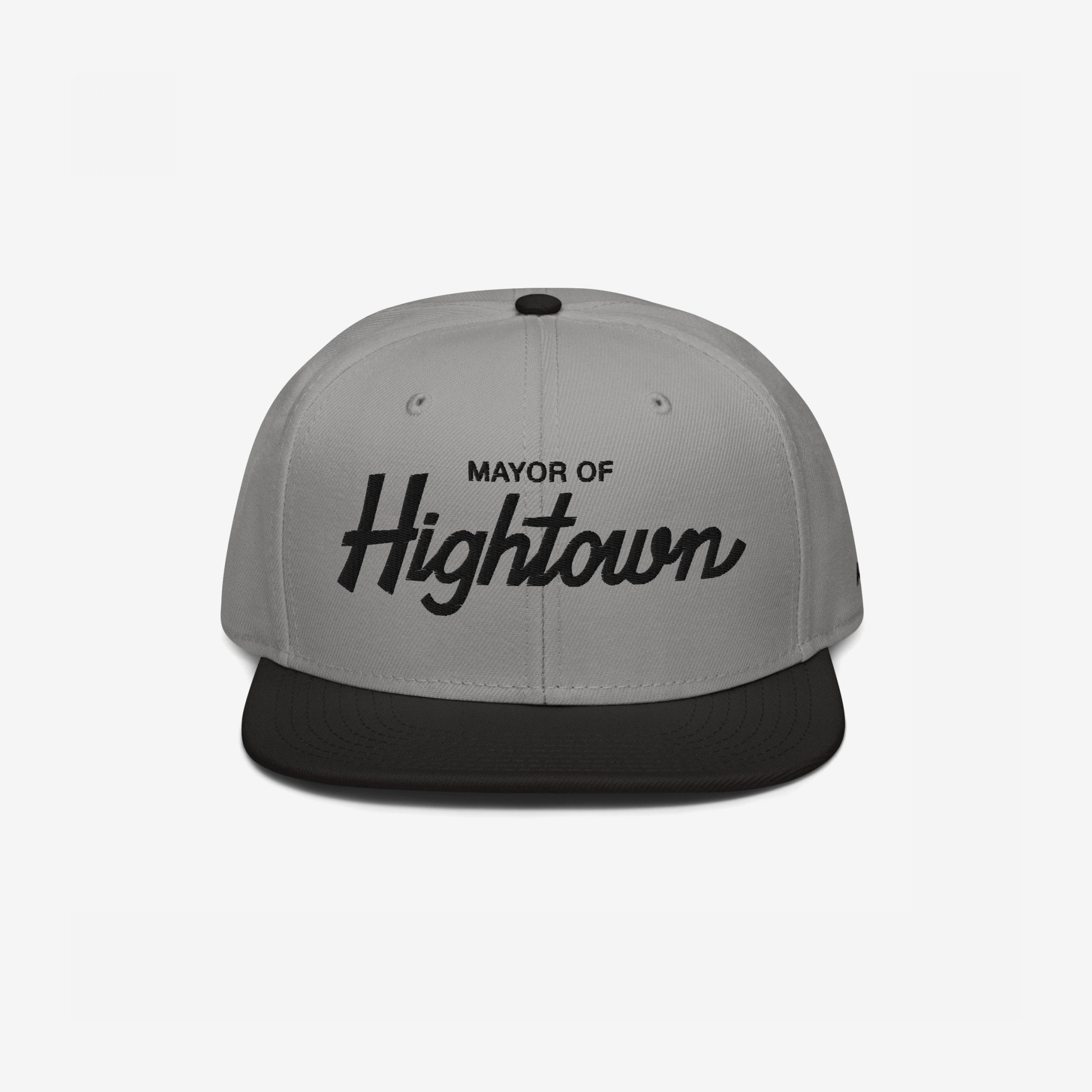 Two-tone flat-bill snapback cap with Mayor of Hightown embroidered on the front, embodying a playful and rebellious spirit ideal for cannabis enthusiasts and lovers of elevated humor.