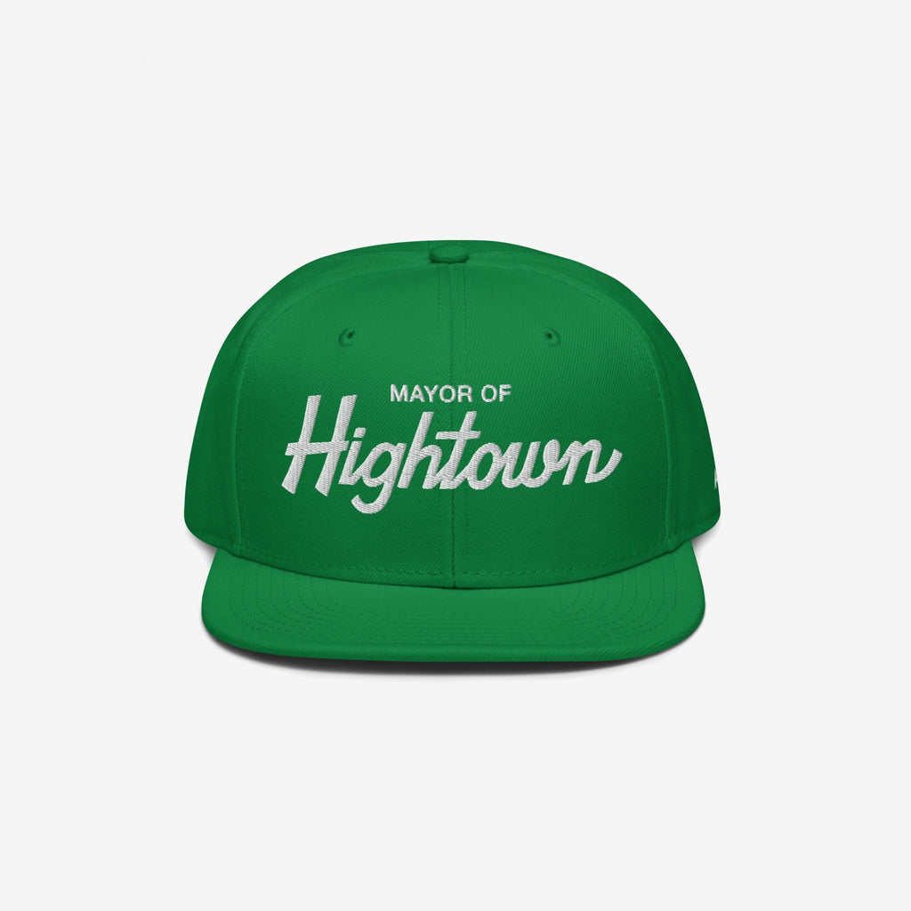 Bright green snapback cap with Mayor of Hightown in white embroidery, embodying bold, cheeky cannabis culture style, ideal for those seeking carefree vibes and elevated humor in their headwear.
