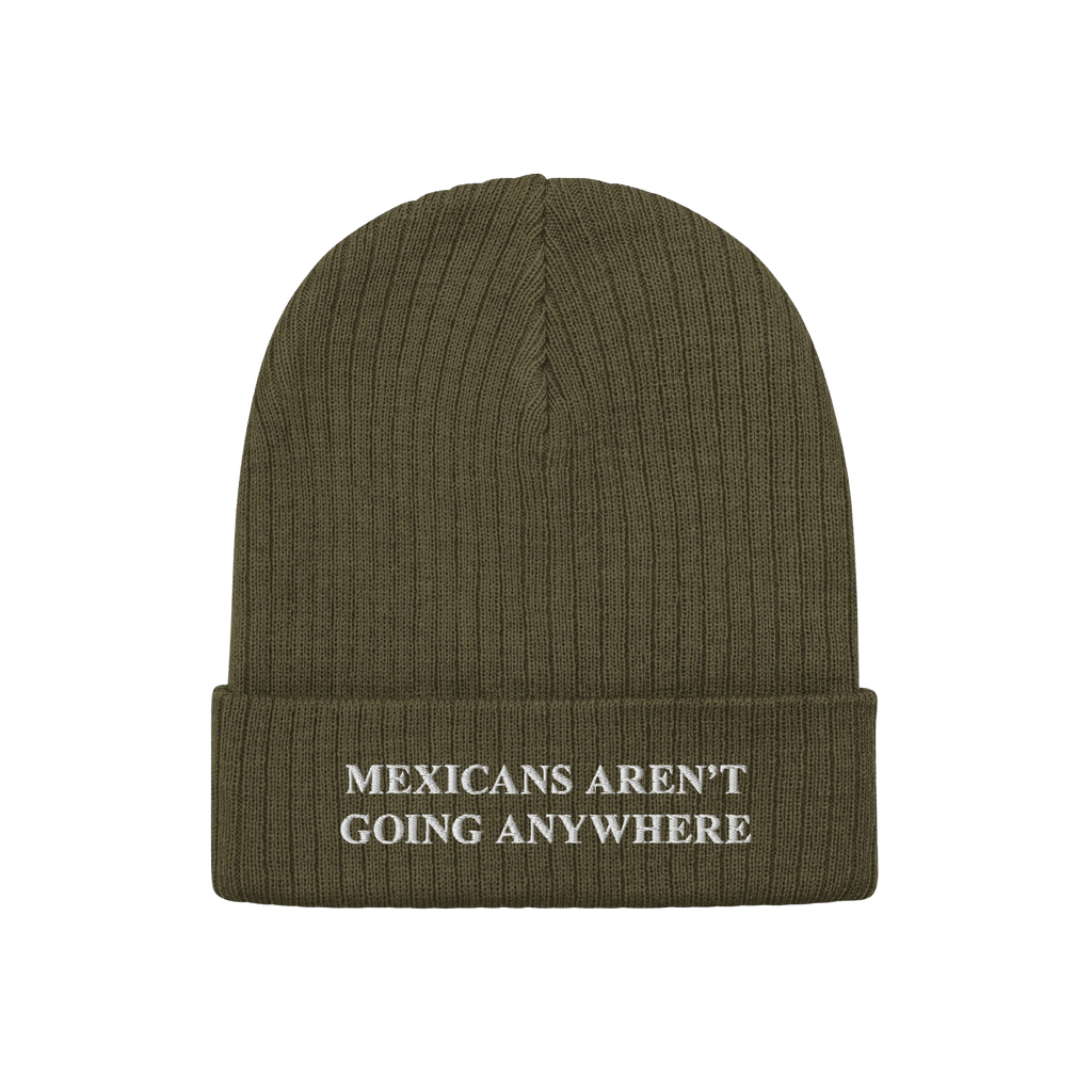 The Mexicans Aren’t Going Anywhere Hat features an olive-green rib-knit beanie with a folded cuff, embroidered with a bold,