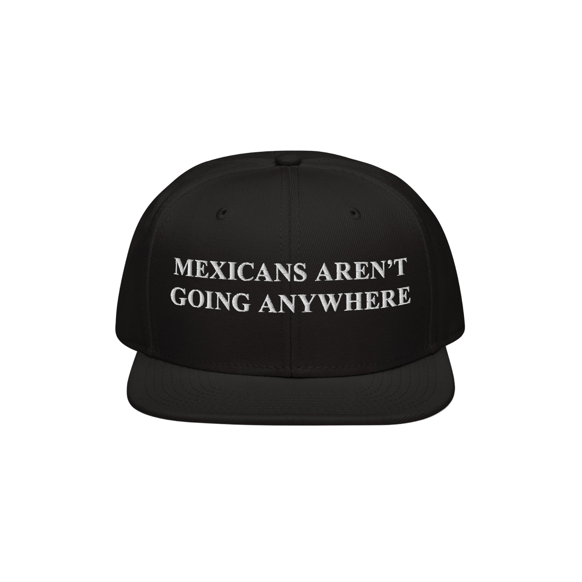 Black snapback hat featuring bold white embroidery reading “Mexicans Aren’t Going Anywhere,” symbolizing pride and resi