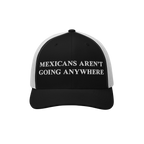 Mexicans Aren’t Going Anywhere Hat: A black-and-white trucker hat with bold white embroidery, expressing pride and resistan