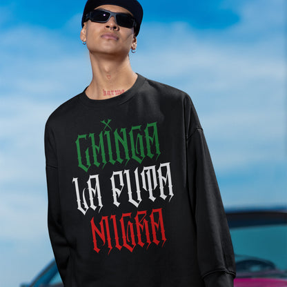 Young person outdoors wearing the Chinga La Migra Mexico Hoodie & Sweatshirt, featuring gothic-style lettering, embodying resistance and pride. The design is bold and unapologetic, aligned with anti-fascism values.