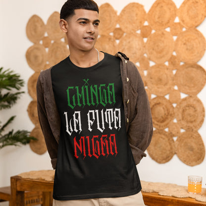 Young man wearing the Chinga La Migra Mexico T-shirt, featuring bold lettering. The shirt represents a stance against anti-immigrant systems, emphasizing cultural pride and resistance.