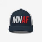 Minnesota As Fuck Anti-Fascist Hat, featuring a trucker-style design with a navy blue front and white mesh back, embroidered with MN in white and AF in red, symbolizing pro-equality and anti-fascist values.