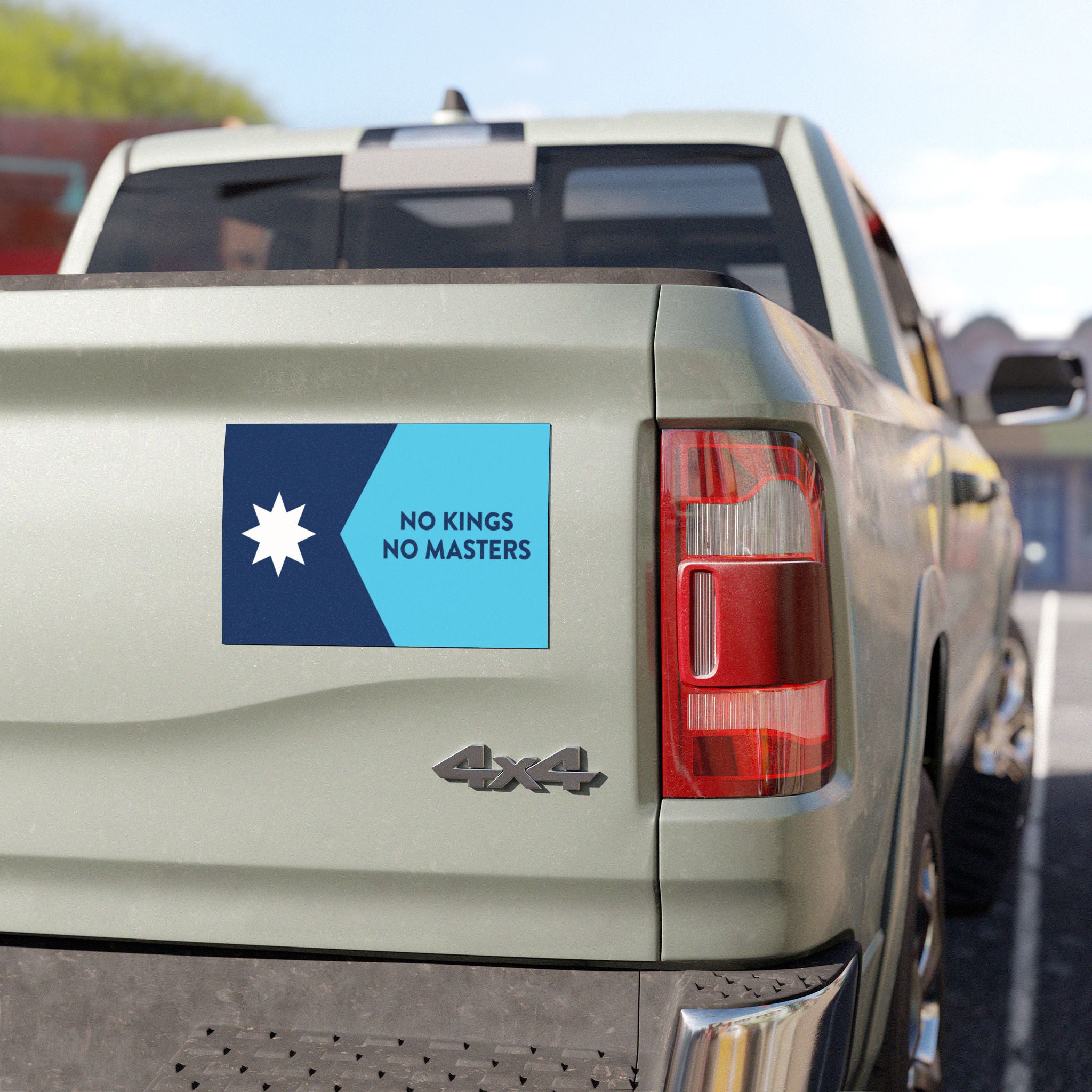 Minnesota Flag No Kings Sticker & Magnet on a light-colored 4×4 pickup truck tailgate, featuring a blue star and bold slogan. A symbol of resistance and pride for Minnesotans.