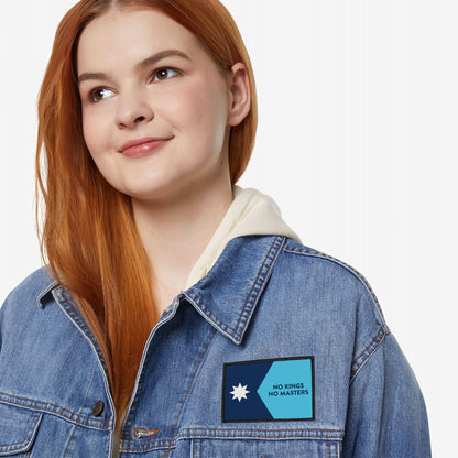 Minnesota Flag No Kings Patch on denim jacket, features a two-tone blue design with a star and NO KINGS NO MASTERS text, symbolizing defiance and autonomy.