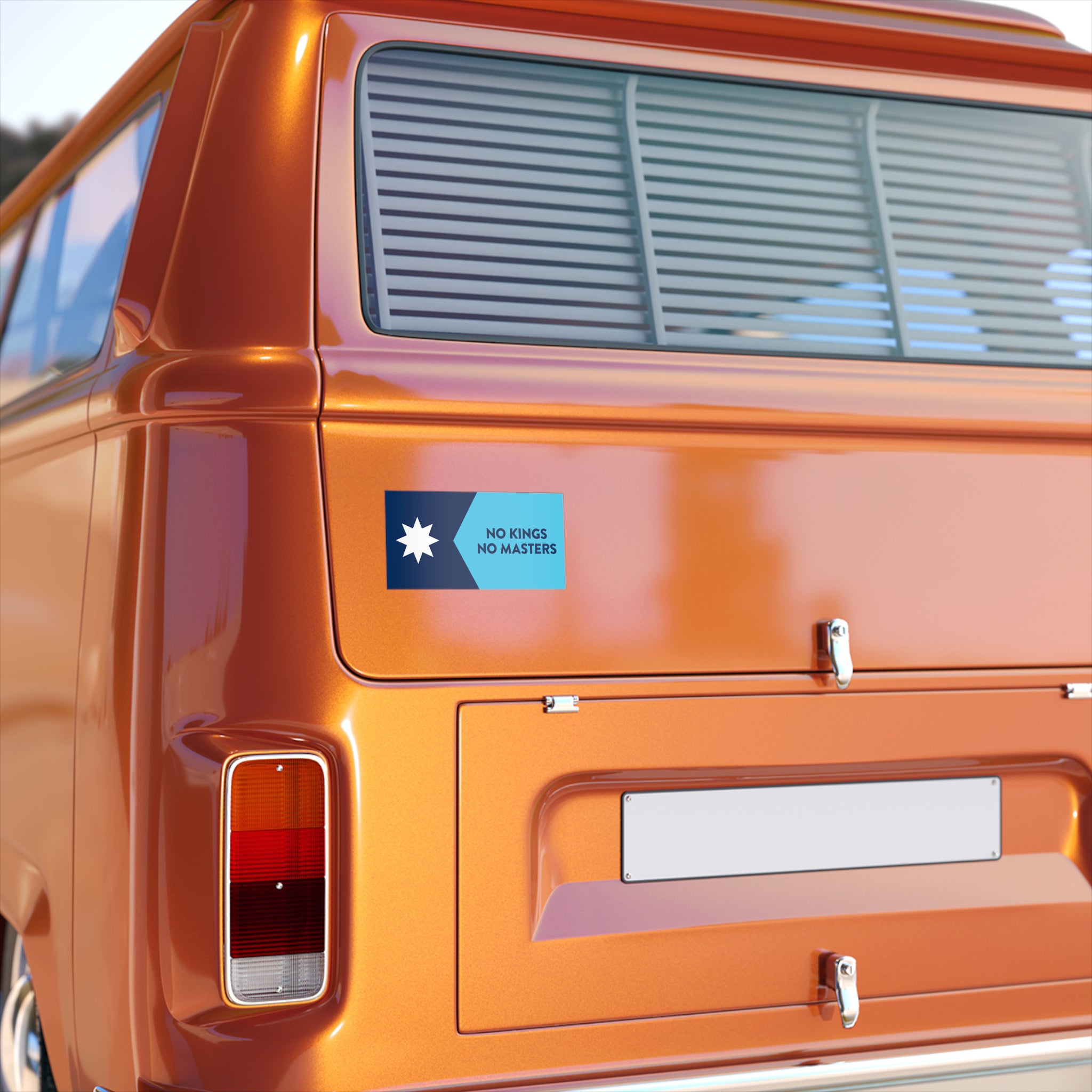 A rear view of an orange vintage-style van features the Minnesota Flag No Kings Sticker & Magnet on the tailgate, displaying NO KINGS NO MASTERS in two-tone blue.