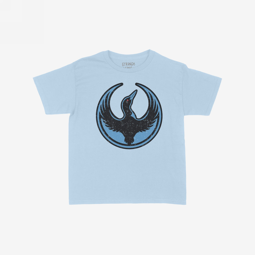 Minnesota Rebel Alliance Women's Baby Tee in light blue, featuring a loon emblem with outstretched wings, symbolizing resistance and equality. The emblem is black with a red eye on a darker blue circle.