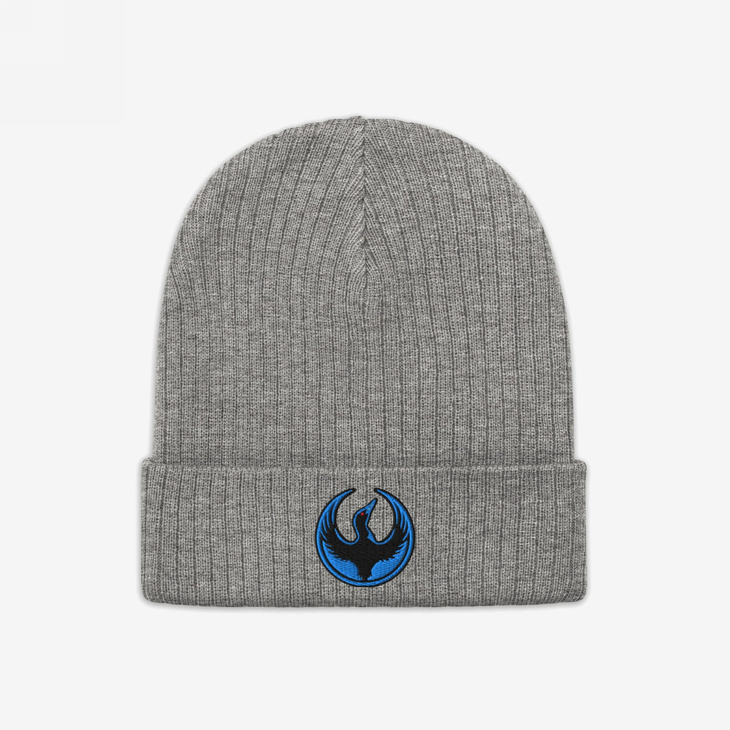 The Minnesota Rebel Alliance Hat features a grey rib-knit beanie with a folded cuff, showcasing an embroidered patch of a stylized black bird, embodying the spirit of protest and equality.