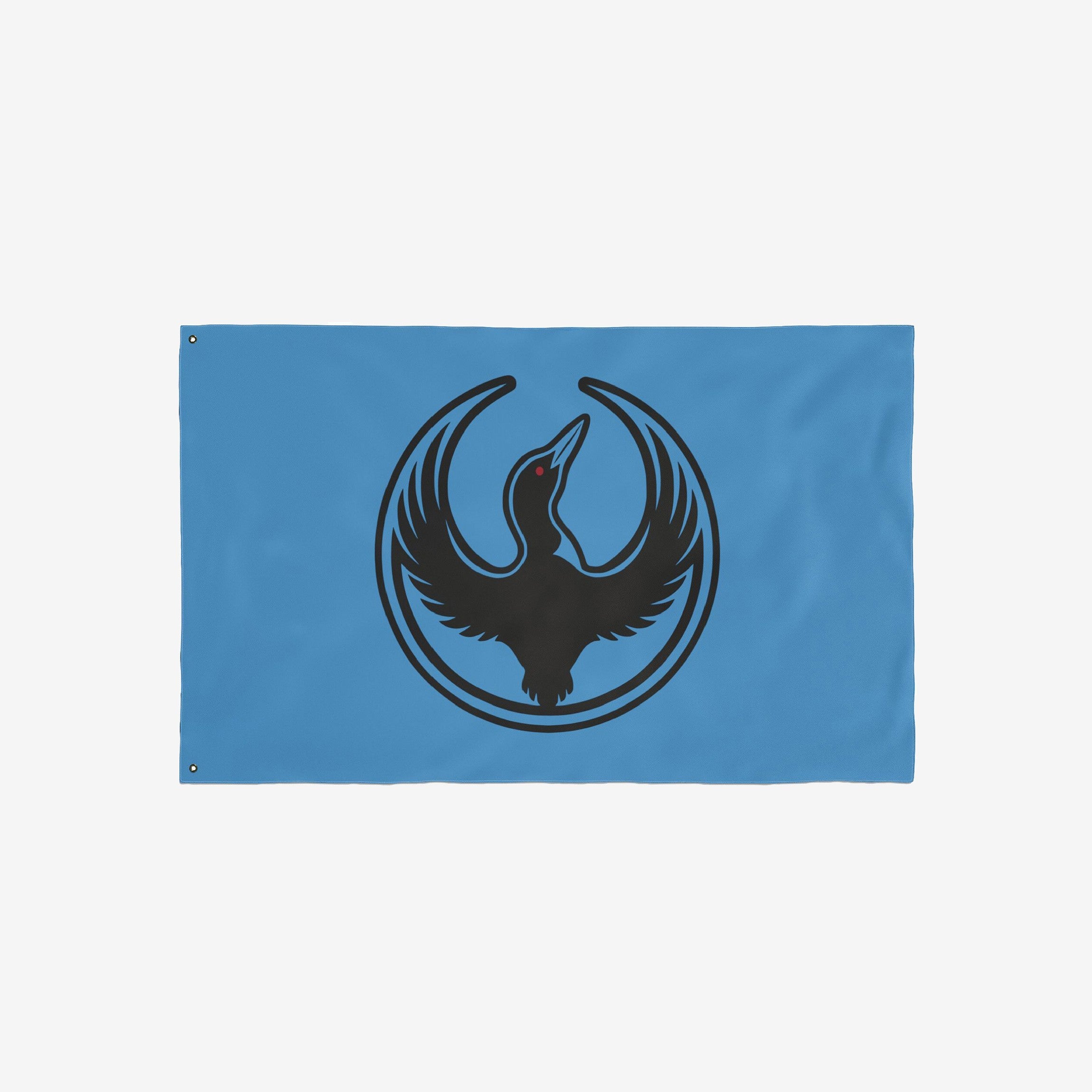 Minnesota Rebel Alliance Flag featuring a bold black loon emblem with outstretched wings on a light-blue background. The design symbolizes resistance and equality, aligning with the store's advocacy for immigrant rights.