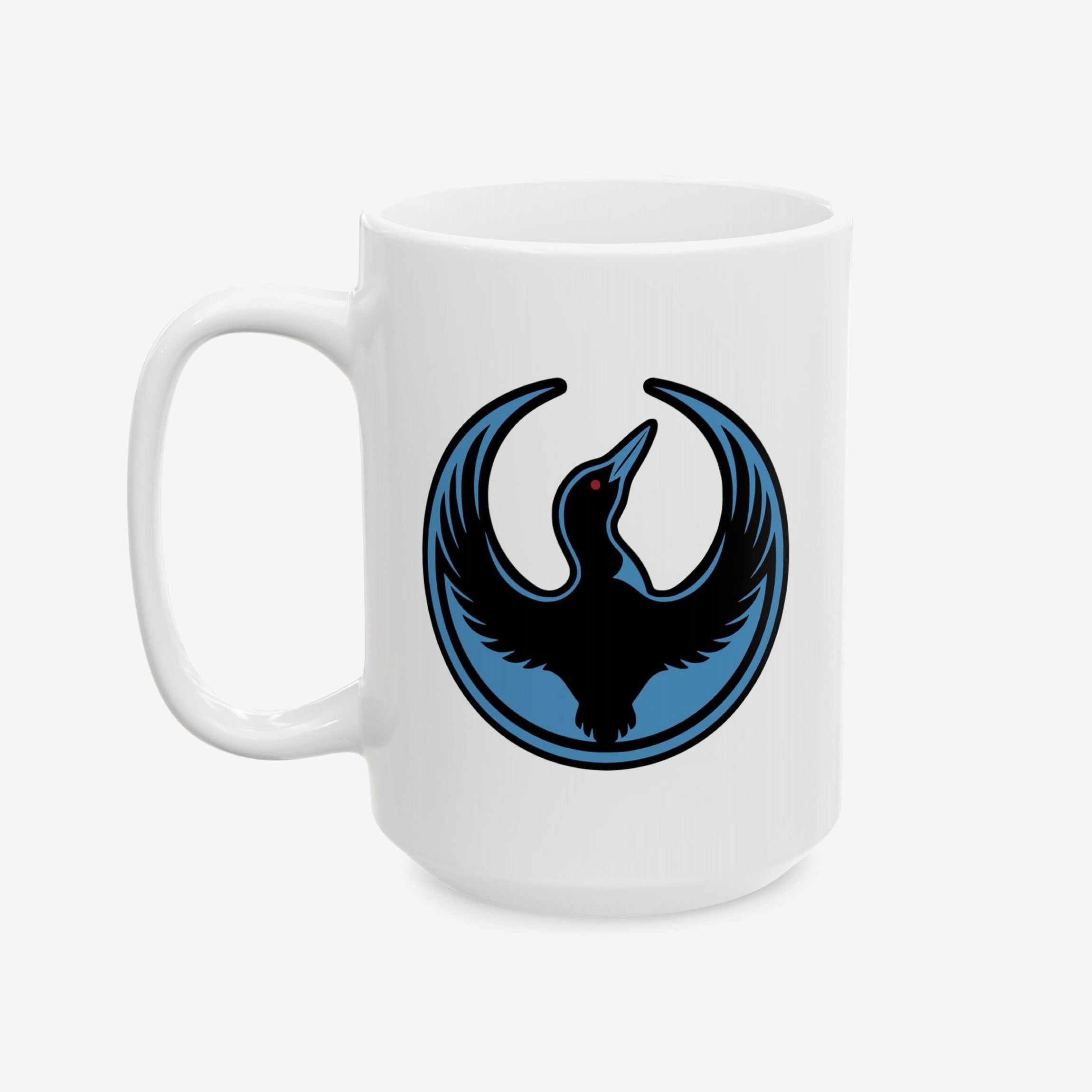 Minnesota Rebel Alliance Mug featuring a black bird with a red eye in a blue circle, symbolizing resistance and solidarity, printed on a white ceramic mug. Available in 11 oz. and 15 oz.