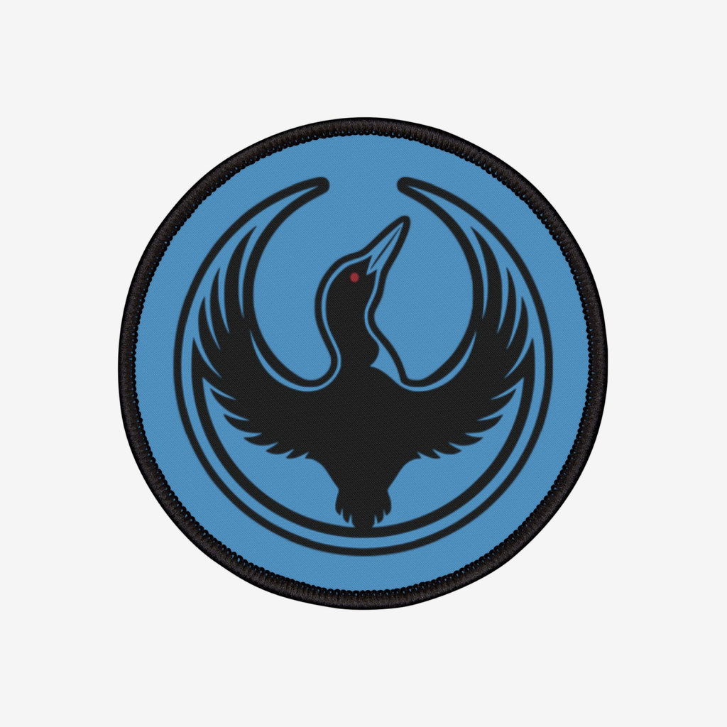 Minnesota Rebel Alliance Patch featuring a stylized black loon with a red eye on a light-blue background, encircled by thin black semicircles, symbolizing resistance and equality.