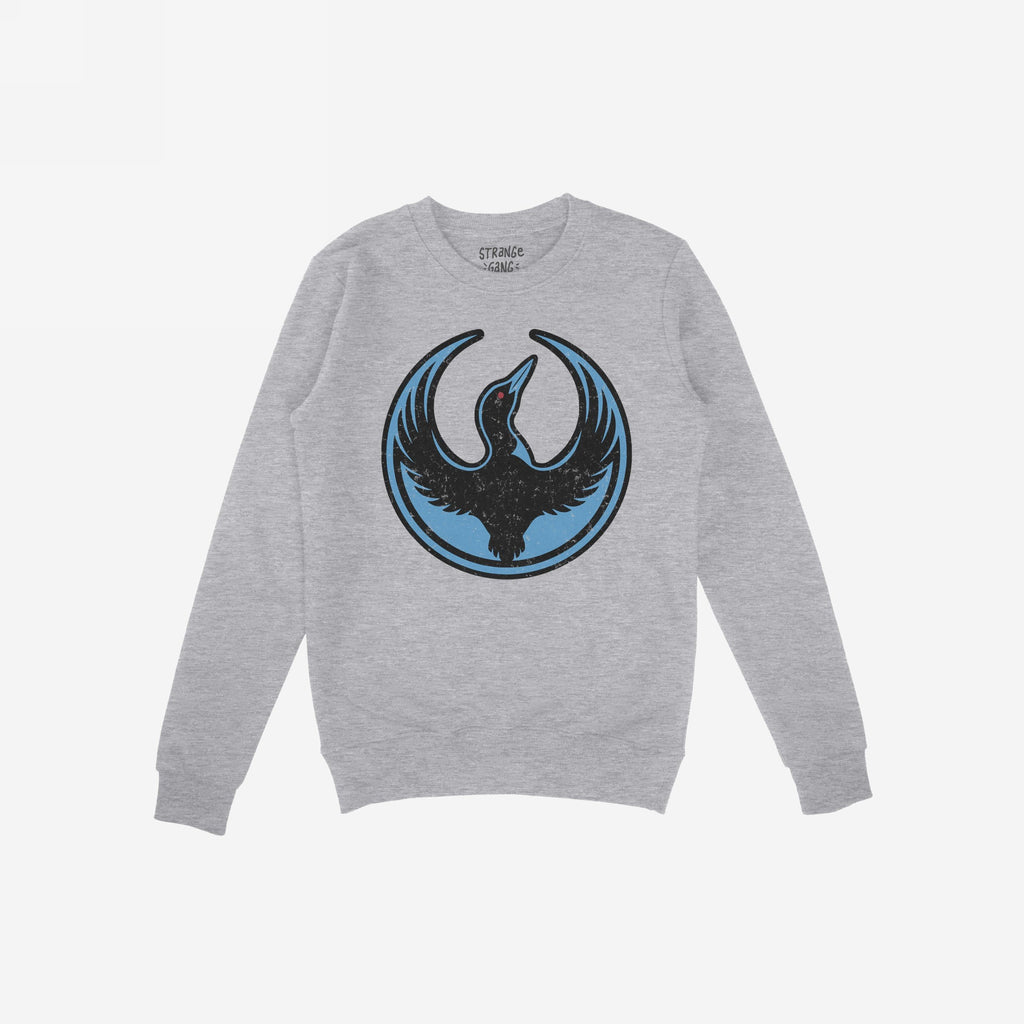 Heather-gray crewneck sweatshirt with the Minnesota Rebel Alliance loon symbol in black and blue. This bold design, by Bernie Anderson, reflects support for immigrant rights and equality.