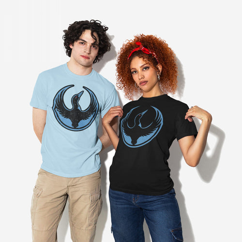 Two young adults model Minnesota Rebel Alliance T-shirts featuring a loon emblem. The man wears light-blue, and the woman wears black against a white backdrop, embodying bold, progressive style.