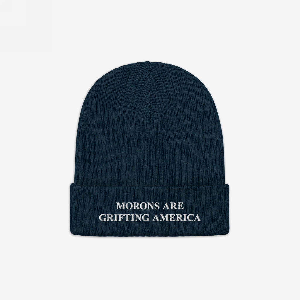 A navy blue ribbed beanie with a cuffed brim and white embroidery reading "MORONS ARE GRIFTING AMERICA." This anti-MAGA beanie offers a minimalist, winter-ready statement with a conscience.