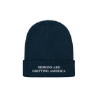 A navy blue ribbed beanie with a cuffed brim and white embroidery reading "MORONS ARE GRIFTING AMERICA." This anti-MAGA beani