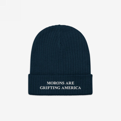 Morons Are Grifting America Hat: A dark navy-blue rib-knit beanie featuring bold white embroidery on the cuff. This statement piece embodies political realism and supports Amnesty International's cause.