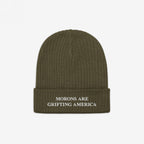 An olive green cuffed beanie made from recycled materials, embroidered with the message "MORONS ARE GRIFTING AMERICA" in white. The anti-MAGA design pairs rugged earth tones with sharp political commentary.