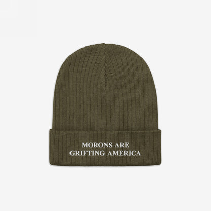 Olive-green ribbed knit beanie with MORONS ARE GRIFTING AMERICA embroidered in white on the cuff, reflecting bold political commentary and unapologetic truth, aligning with standing up for equality and justice.