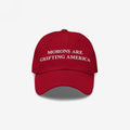 Red dad hat styled to mimic MAGA caps but flipped with embroidered white text "Morons Are Grifting America" — a direct anti-MAGA statement in their own colorway.
