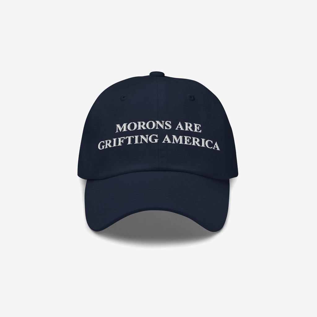 Navy blue dad hat with striking white embroidery of "Morons Are Grifting America" across the front — a sleek, understated take on the anti-MAGA callout.