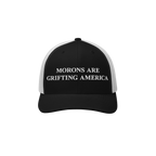 Retro black and white trucker hat with bold anti-MAGA message embroidered in white: "Morons Are Grifting America"