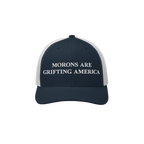 Classic navy blue and white retro trucker hat with anti-MAGA slogan: "Morons Are Grifting America"