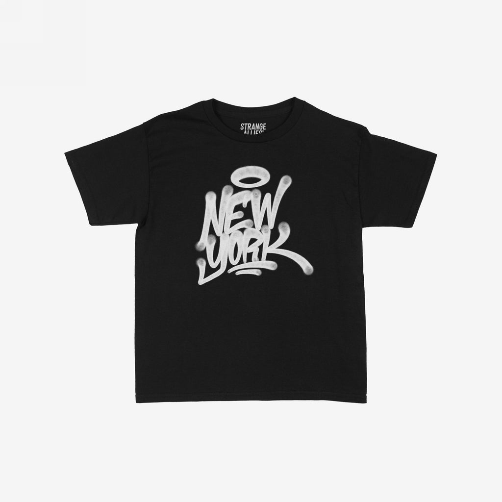 New York Handstyle Women's Baby Tee: Black crew-neck tee with NEW YORK in bold, graffiti-style white letters and halo icon, embodying NYC's bold spirit. Brand STRANGE ALLIES inside collar.