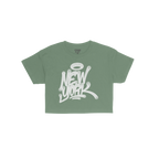 New York Handstyle Women's Baby Tee featuring a white graffiti-style New York with a halo graphic on a green short-sleeve shi