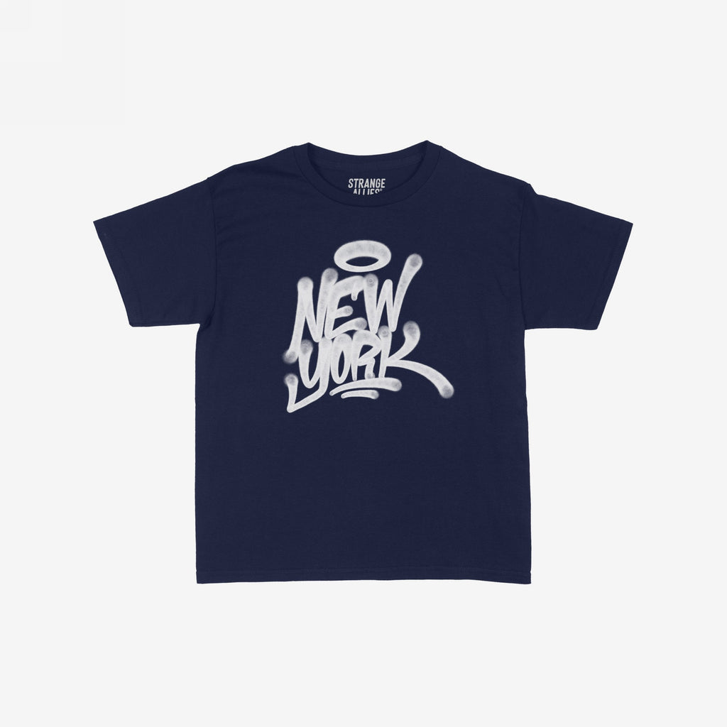 Navy-blue New York Handstyle Women's Baby Tee featuring graffiti-style “NEW YORK” with a halo. Laid flat, emphasizing bold urban style and artistic flair. Neck label reads “STRANGE ALLIES.”